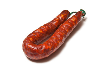 Spanish Chiriso sausage isolated on a white studio background.
