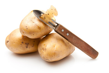 Potatoes with potato peeler