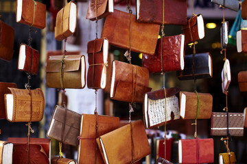 Notebooks with leather cover hanging on the market