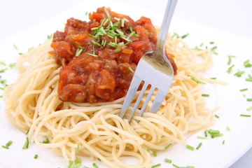 Spaghetti Bolognese being eaten with a fork