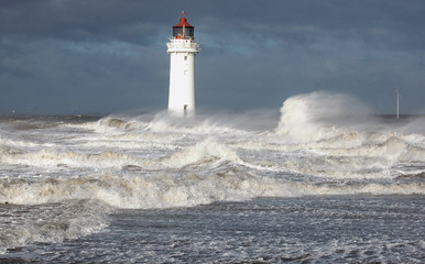 Waves ride up against New Brighton Lighthouse
