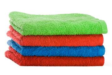 Stack of color towels isolated over white background