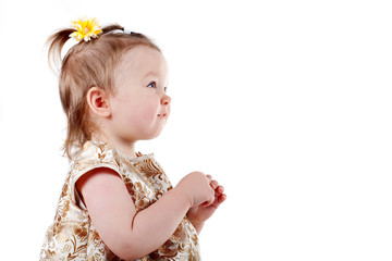 little beautiful girl looks up isolated on white