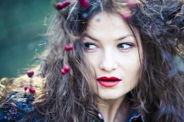Naklejka premium Portrait of beautiful woman with hawthorn