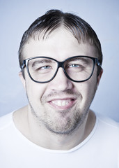 Funny smiling man in glasses