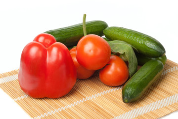 Ripe vegetables on a straw mat