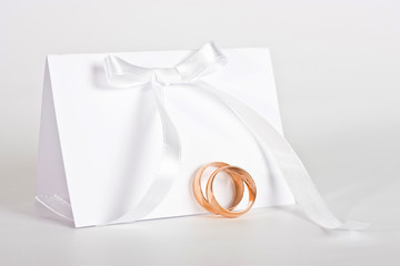 Wedding rings and complimentary ticket