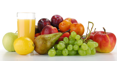 Variety of fruits and glass of orange juice isolated on white