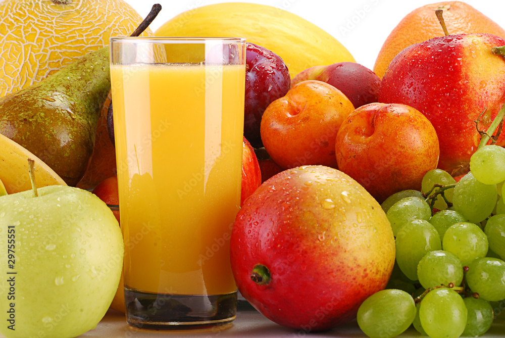 Wall mural Variety of fruits and glass of orange juice