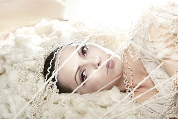 Young beauty with perfect skin and artificial eyelashes