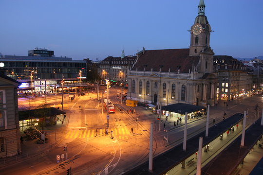 Trainstation and Heilig-Geist-Kirche in the city of Bern, capital of Switzerland