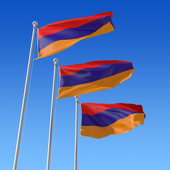 Fototapeta na wymiar Trzy flagi Armenii przeciw błękitne niebo.