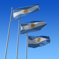 Obraz premium Three flags of Argentina against blue sky.