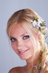 Naklejka premium Beautiful girl with flowers in her hair