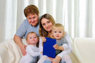 Obraz premium two twins sisters with their grandmother