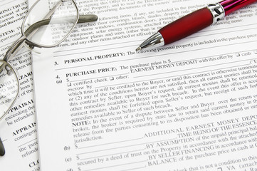 mortgage application contract document and pen