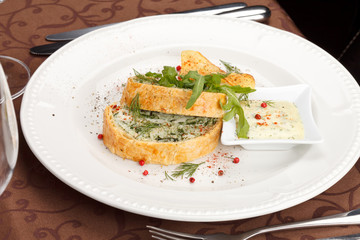 fish pie with sauce and potato chips