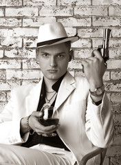 Mafia man with gun. Gangster