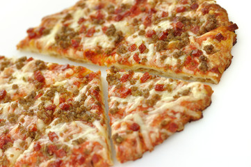 mini pizza topped with sausage and pepperoni