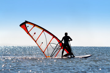 Windsurfer picks up the sail