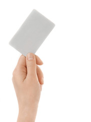 Business card in female hand. Studio isolated.