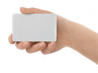 Business card in female hand. Studio isolated.