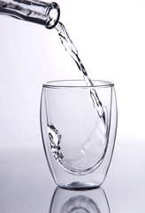 Water falling into glass