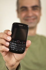 Guy holding a Cell Phone