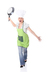 Angry young woman cooking
