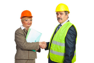 Middle aged architects hand shake