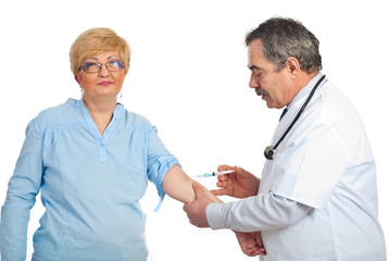 Mature  doctor vaccine patient woman