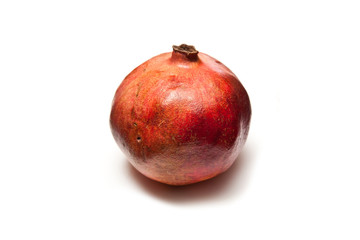 Pomegranate isolated on a white studio background.
