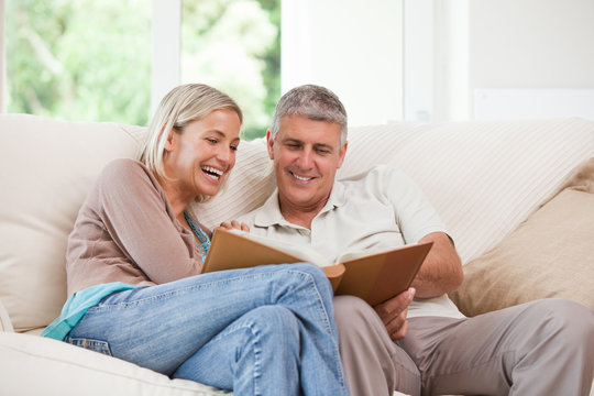 Couple looking at their photo album