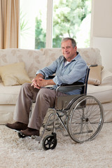 Fototapeta na wymiar Senior man in his wheelchair