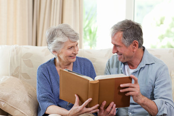 Seniors looking at their photo album