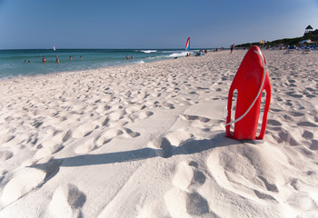 Red lifesavers board on Playa Del Secreto beach.