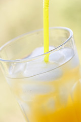 glass of orange juice with ice