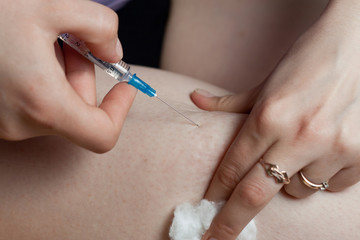 hand and syringe