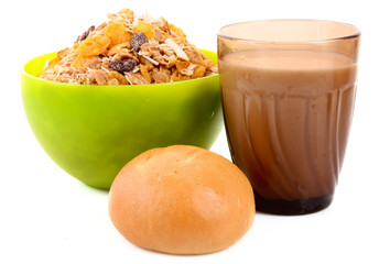 Muesli, bun and milk isolated on white