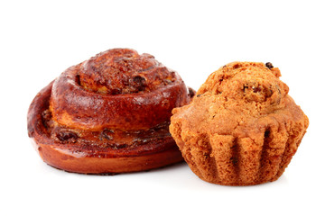 Loaf with raisins and muffin isolated on white