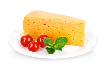 yellow cheese in plate with tomatoes and leaf