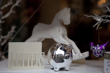 wood white horse standing  on window shell in shop
