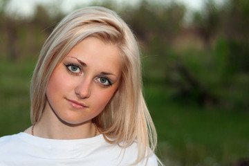 Closeup portrait of young lovely blonde