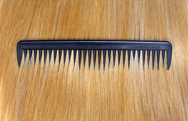 Fototapeta premium Fair hair and comb