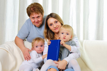 Obraz premium two twins sisters with their grandmother