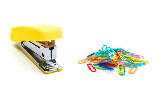 Yellow stapler and colour paperclips