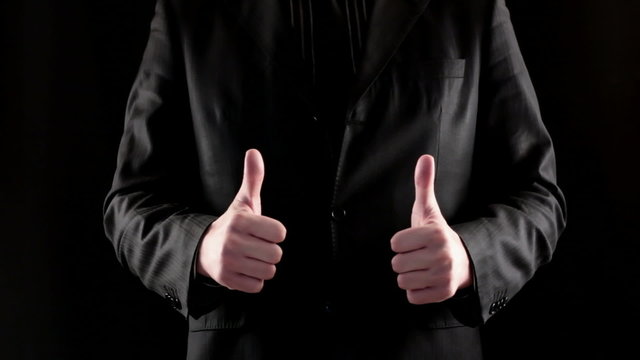 Businessman hand showing thumb up