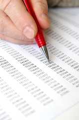 Male hand and business document lying on the table