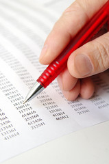 Male hand and business document lying on the table