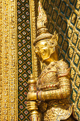 Fototapeta na wymiar Stucco giant gold in the Temple of the Emerald Buddha, Thailand.